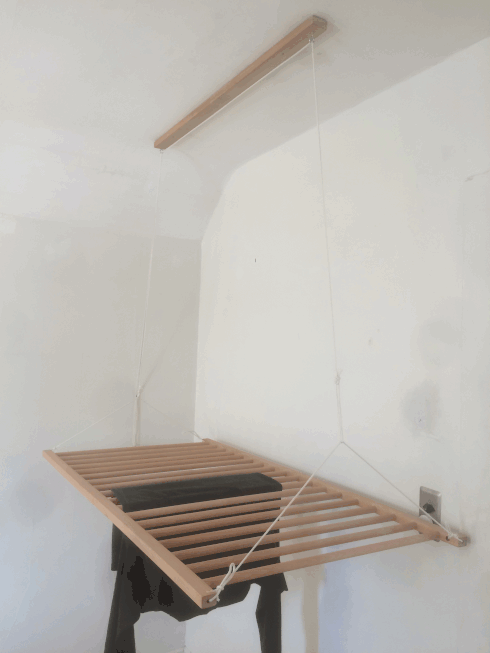 hanging clothes rack GIF with showing both the lowered and raised positions